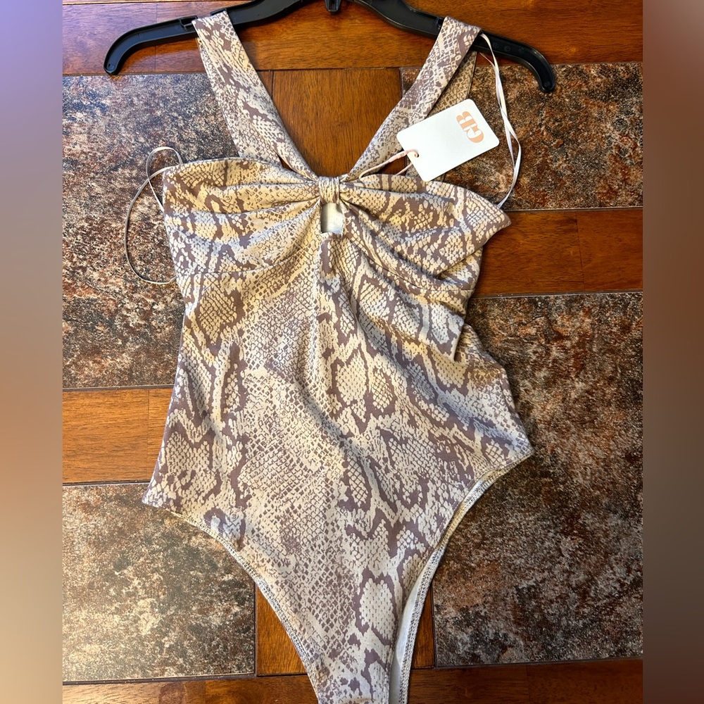 New with tags snake skin GB bodysuit. Size XS never worn